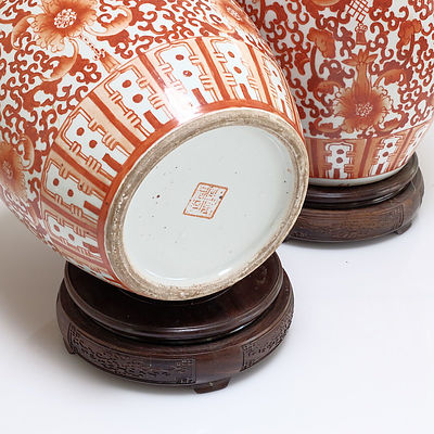 Pair of Chinese Coral Red Decorated Jars on Rosewood Stands