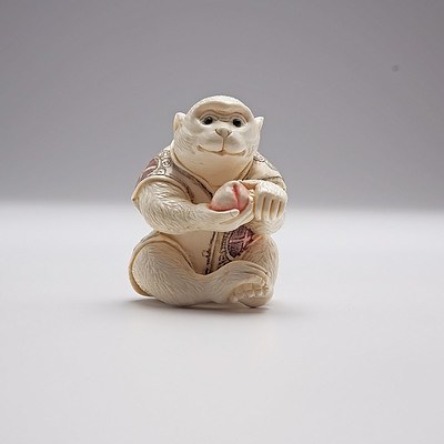 Japanese Carved and Stained Ivory Netsuke of a Monkey