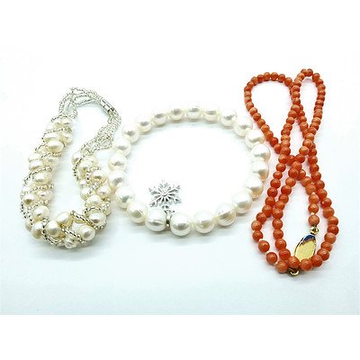 Two Fresh Water Pearl Bracelets and a Stand of Pink Coral