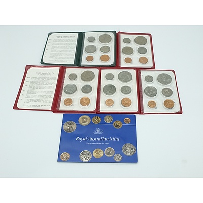 Six Uncirculated Coins Sets, Including 1984 Coin Set in Yellow Plastic
