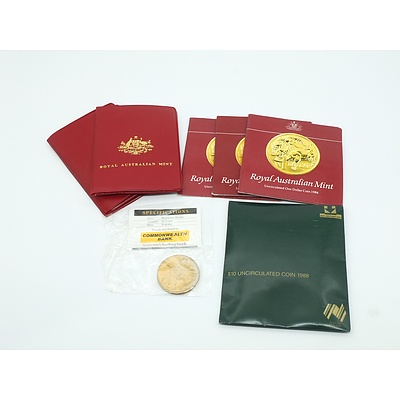 Three 1984 Uncirculated $1 Coins, 1988 $10 Uncirculated Coin, 1988 $5 Commemorative Coins, 1981, 1981 and 1983 Uncirculated Red Wallet Coin Sets