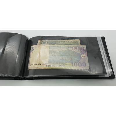 Booklet with Assorted Foreign Banknotes Including Fijian, American, Indonesian Notes and More