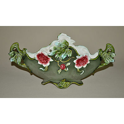 Austrian Amphora Porcelain Centrepiece. Conch shell supported by three fishermen, painted in bronze & yellow. Incl. an Eichwald earthenware compressed oval vase with moulded floral decoration on matt green ground.