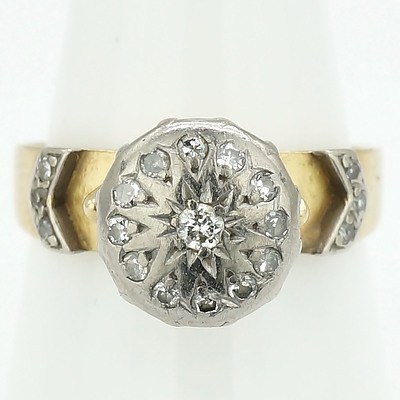 18ct Yellow Gold Ring with White Gold Setting Around ""Illusion"" Plate with Centre Round Brilliant Cut Diamond and Twelve Single Cut Diamonds