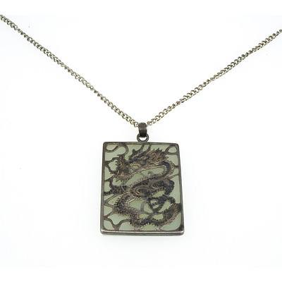 Chinese Square Pendant With Flat Slab of White Jade with Pieced and Engraved Silver Dragon Mount