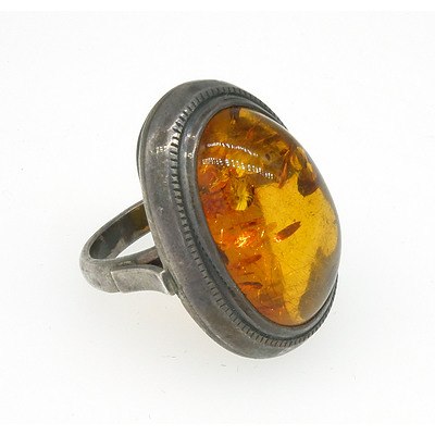 Sterling Silver Ring with Oval Cabochon of Amber
