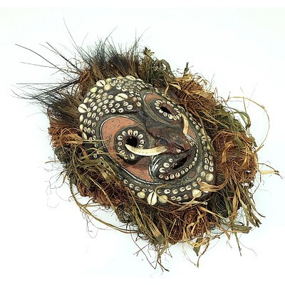 Sepik Mud Overlaid Turtle Shell Mask with Feather and Shell Adornments, Papua New Guinea