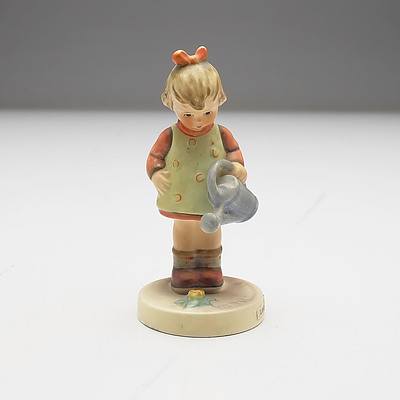 Three Porcelain Pin Cushion Half Dolls and a Hummel Figurine