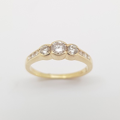18ct Yellow Gold Diamond Ring with Flat Band Set with 3 Brilliant Cut Diamonds in Each Shoulder And 3 Brilliant Cut Diamonds Set in the Centre