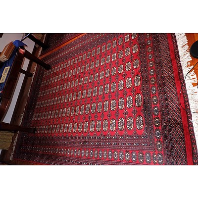 A Large Hand Knotted Wool Pile Bokhara Rug Similar To The Previous Lot
