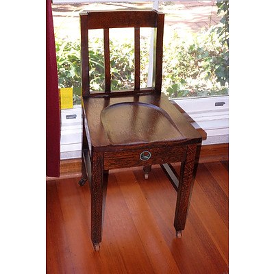 An Antique Oak Sewing Chair with Original Bluebird Decal