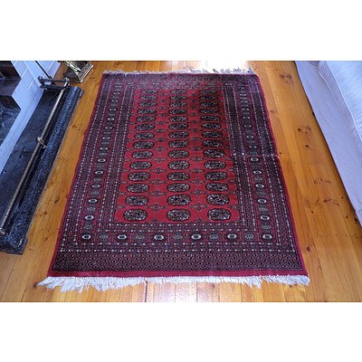 A Hand Knotted Wool Pile Bokhara Rug