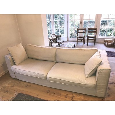 A Contemporary Linen Slip Covered Three Seater Sofa
