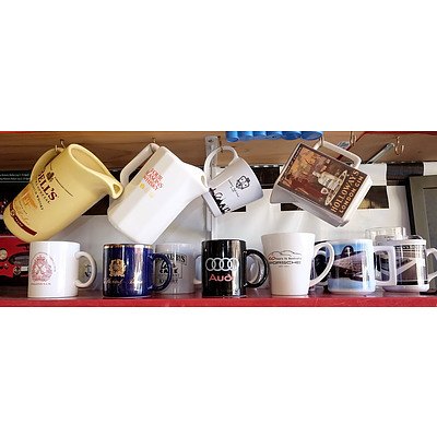 Bells Four Seasons Whiskey and Holloways Whiskey Jugs and a Shelf of Automotive and Other Mugs