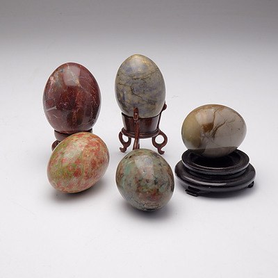 Five Semi Precious Stone Eggs and Three Stands