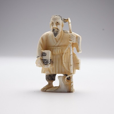 Small Carved Ivory Man with Rod