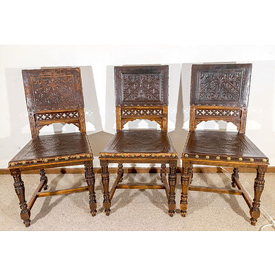 Six Late Victorian Walnut and Embossed Leather Dining Chairs with Tudor and Gothic Influence
