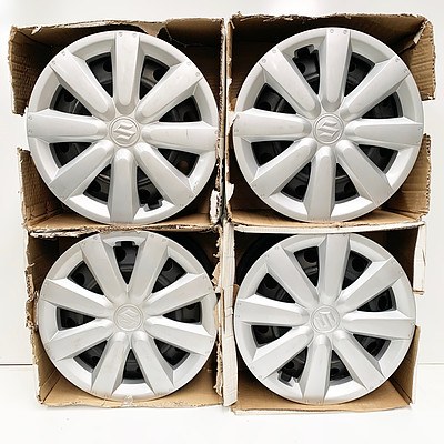 Four Suzuki Hubcap Covered 16