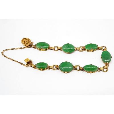 Chinese 14ct Yellow Gold Bracelet with Seven Oval Cabochons of Apple Green Jadeite
