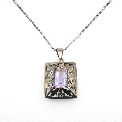 Emerald Cut Pale Amethyst in Four Claws Above a Fancy Pierced Box Pendant on a Silver Scroll Chain