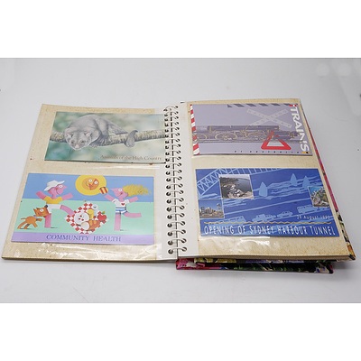 Four Stamp Albums with Various Australian and International Stamps, Australian First Day Covers, and Australia Post Stamp Sets