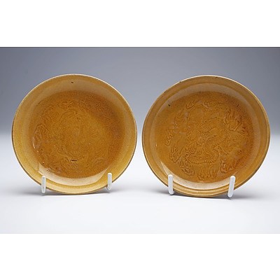 Pair of Chinese Soft Paste Yellow Glaze Saucer Dishes with Stamped Dragon Decoration, Late Qing