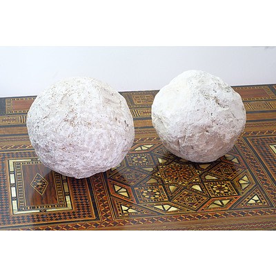 Two Archaic Style Limestone Catapult Balls