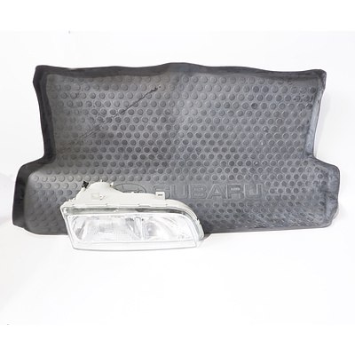 Subaru Boot Mat and a Left Front Car Headlight