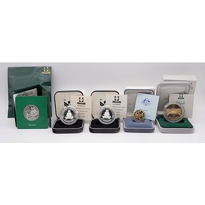 Two 1986 $10 Proof Coins, 1984 $1 Proof Coin First Year of Issue, 1988 $5 Proof Coins, 1988 Silver Uncirculated Coin