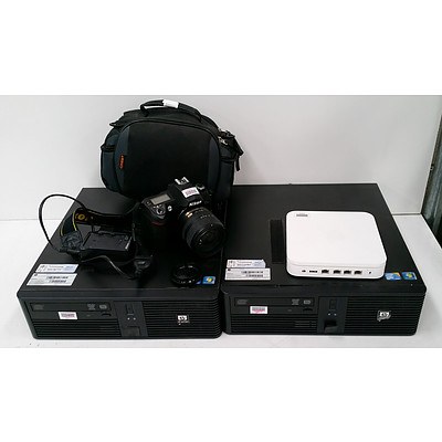 Two HP rp5700 Computers, Nikon D70s with Nikkor 18-70mm 1:3.5-4.5G ED Lens and Charger, and Apple 4th Gen AirPort Extreme Base Station