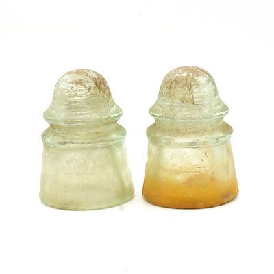 Two Vintage Green Glass Insulators