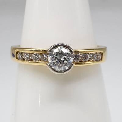 18ct Yellow Gold Ring with 0.30ct Round Brilliant Cut Diamond and Eight Round Brilliant Cut Diamonds