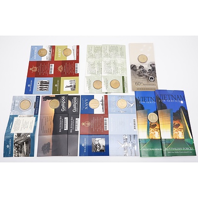 Twelve RAM Uncirculated One Dollar Military Themes Coins, Including 2003 Vietnam for Service, 2003 Korean War, 2001 Navy 90th Anniversary and More