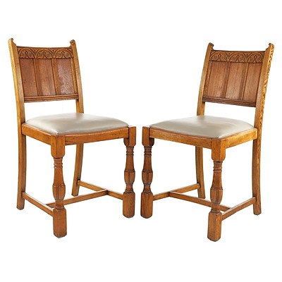 Four English Oak and Leather Upholstered Dining Chairs in the Tudor Style Circa 1930s