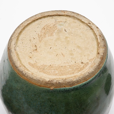 Antique Chinese Green Glazed Stoneware Jar with a Moulded Ruyi Border, Pierced and Carved Hardwood Stand and Cover