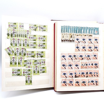 Two Partially Filled Albums with New Guinea Stamps