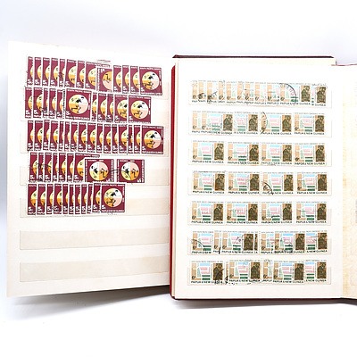 Two Partially Filled Albums with New Guinea Stamps
