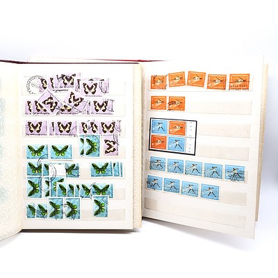 Two Partially Filled Albums with New Guinea Stamps