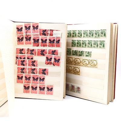 Two Partially Filled Albums with New Guinea Stamps