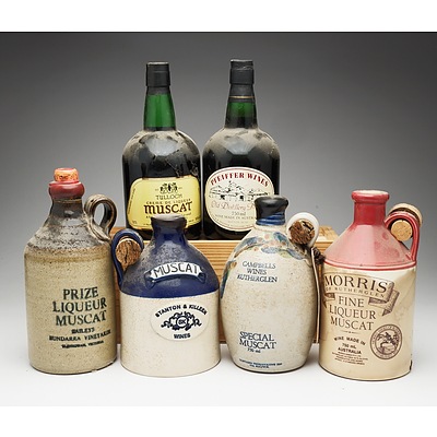 Group of Six Muscat Stoneware Decanters