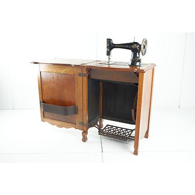 Vintage Oak Sewing Machine Cabinet with New Century Ace Sewing Machine