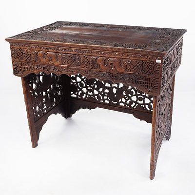 South Chinese or Burmese Teak Campaign Desk Profusely Carved with Dragons and Auspicious Symbols, Circa 1900
