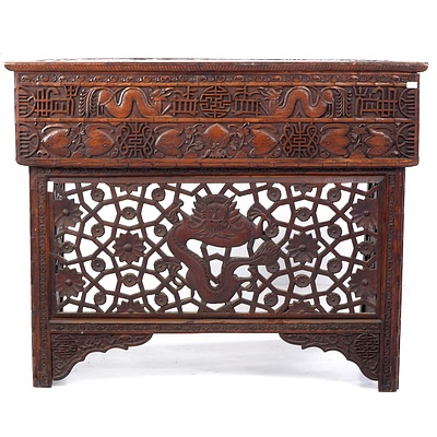 South Chinese or Burmese Teak Campaign Desk Profusely Carved with Dragons and Auspicious Symbols, Circa 1900