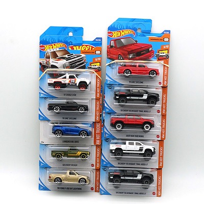 Ten Boxed Hot Wheels HW Hot Trucks Model Cars, Including 91 GMC Cyclone, 2020 RAM 1500 Rebel and More 