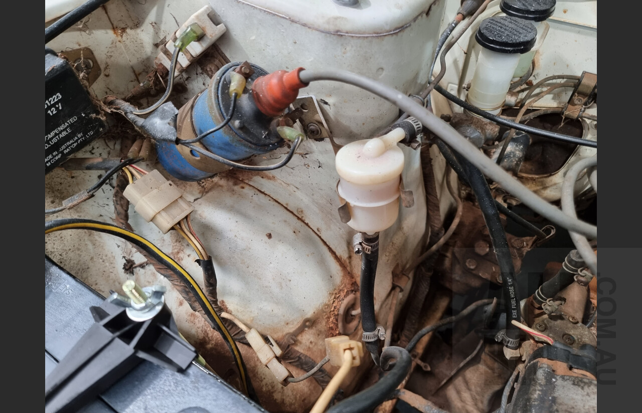 7/1974 Datsun 120y 4d Sedan White 1.2L