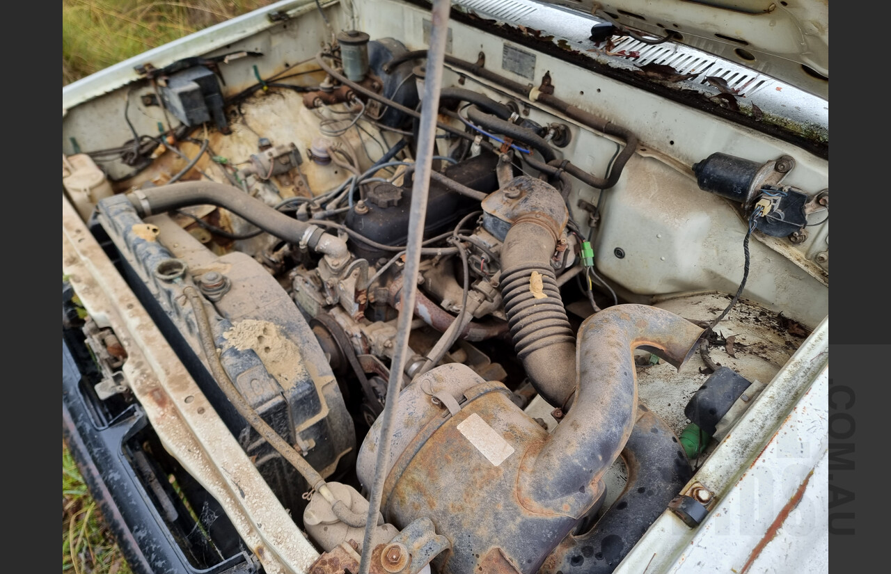 7/1986 Toyota Hilux YN57 2d P/up White 2.0L