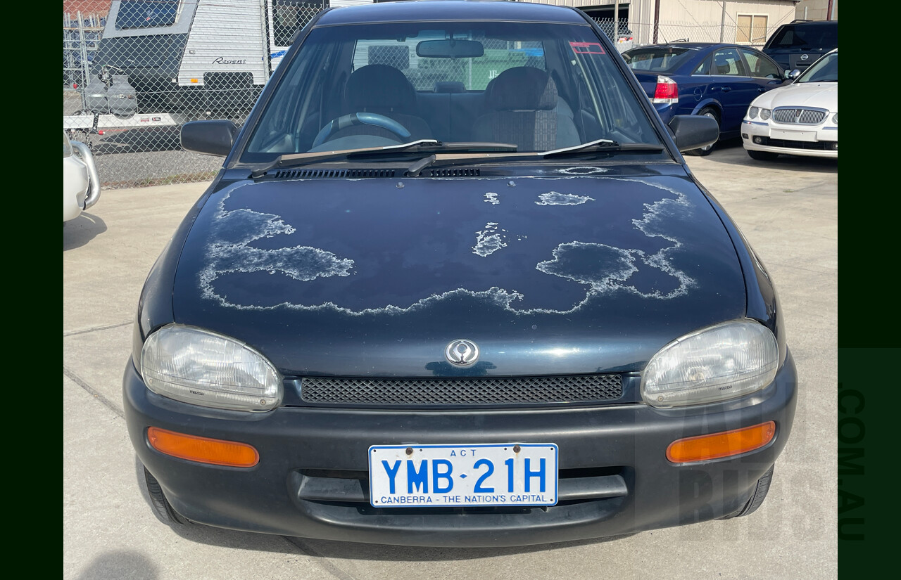 10/1996 Mazda 121 4d Sedan Blue 1.3L
