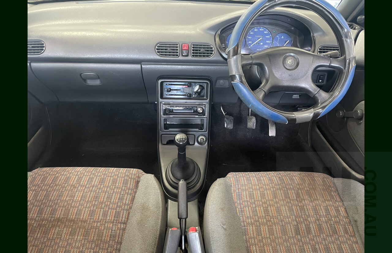 10/1996 Mazda 121 4d Sedan Blue 1.3L