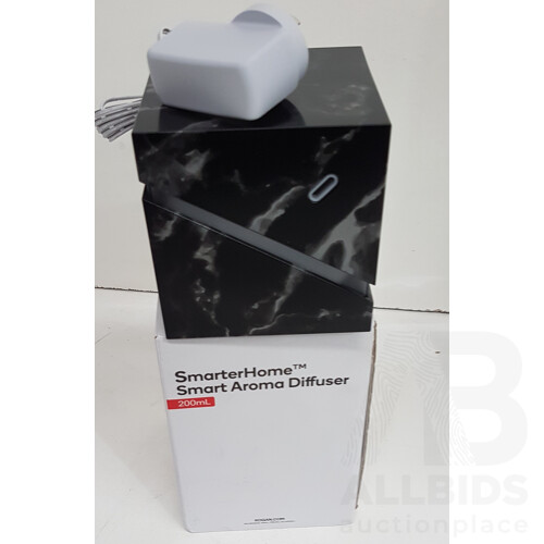 Assortment of Electronics Including Kogan Air Purifier, Smart Aroma Diffuser, Electric Insect Killer, and Motion Sensor LED Flood Light - Lot of 4  - Total ORP $257.98