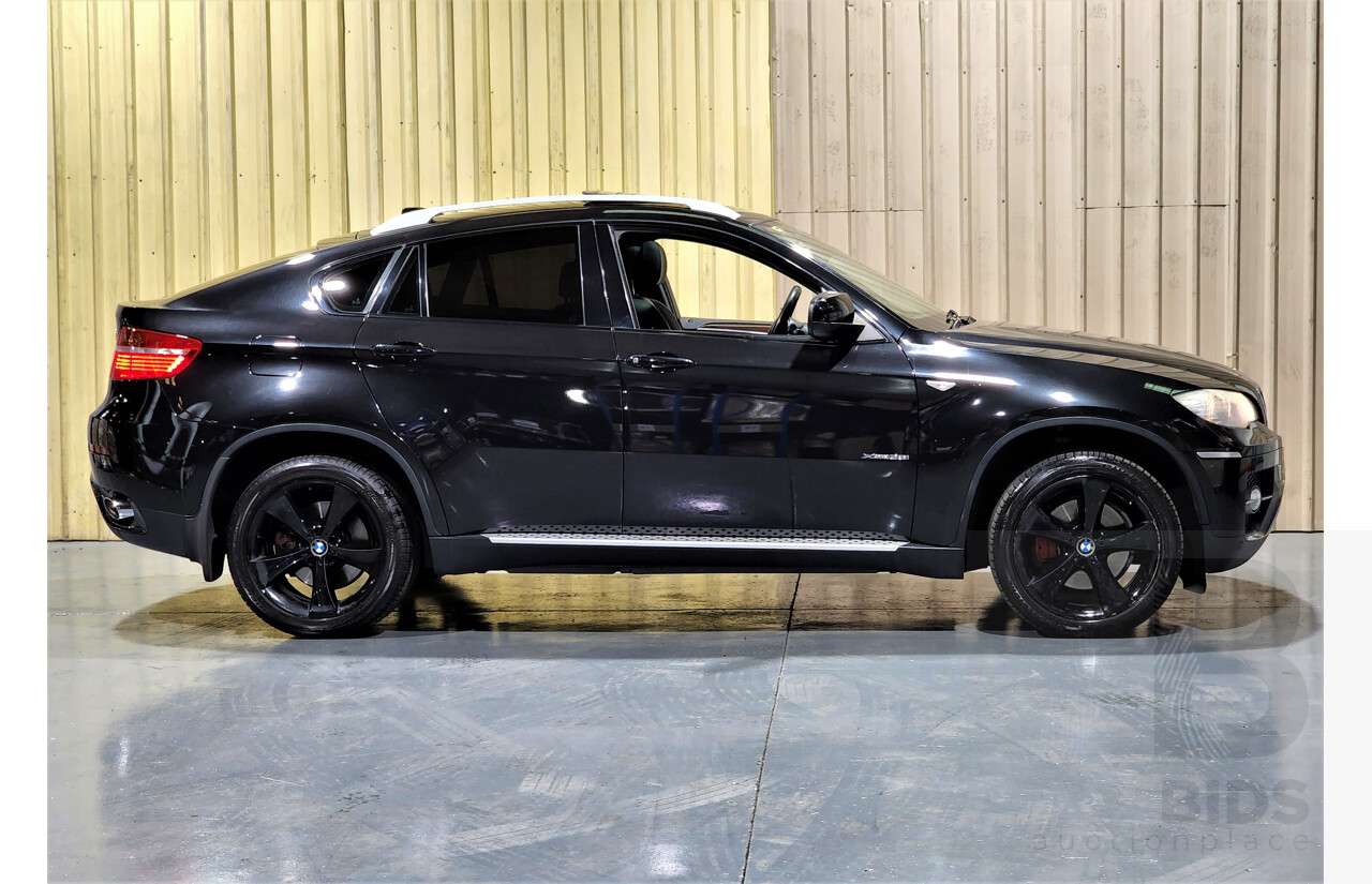 7/2009 BMW X6 Xdrive 35i E71 4d Coupe Black 3.0L Turbo Petrol